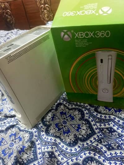 xbox 360 with two wireless controller's, charge able cells and charger
