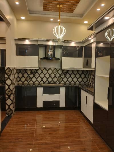 600Sqryd Ground + 1 + Roof top 60-70ft road facing Near Disco Bakery Gulshan-e-Iqbal  Rent demand 7 lac for whole building *Code(16933)*