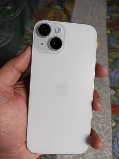 Apple iPhone 15 with charger cable