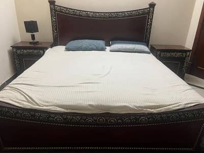 A bed and dressing table