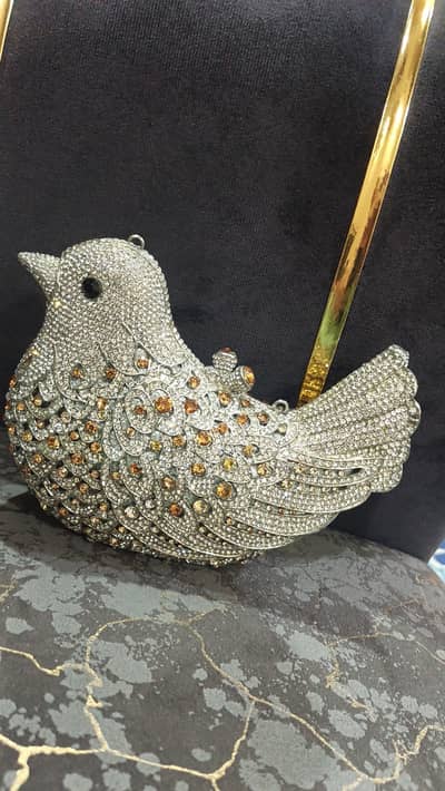 Metel stone pigeon shape  clutch for sale