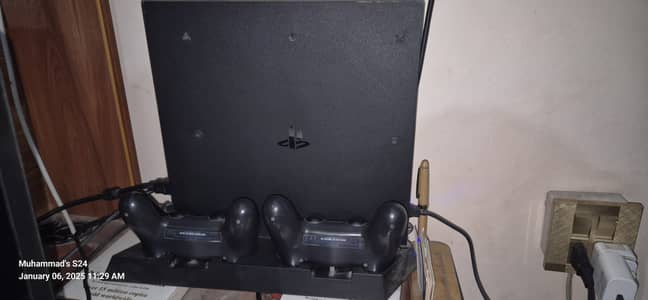 Ps4 pro 1TB with cooling dock and 2 game controllers