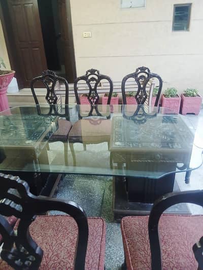 due to shifting. wooden 6 chairs top quality glass