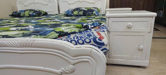 Two single Beds with side tables and mattresses