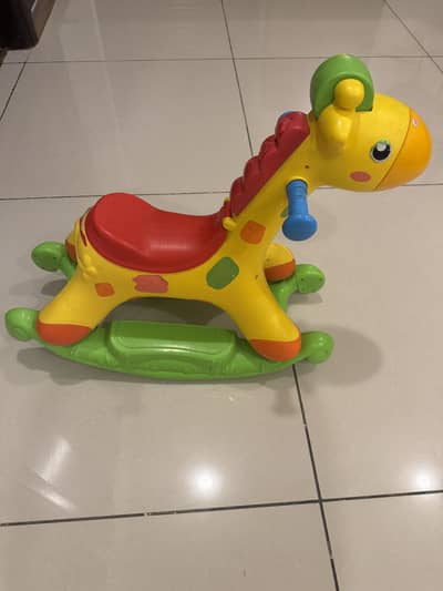 Toddler riding giraffe