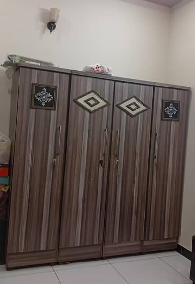 wooden 5 by 6 ft single bed and 4 door wardrobe