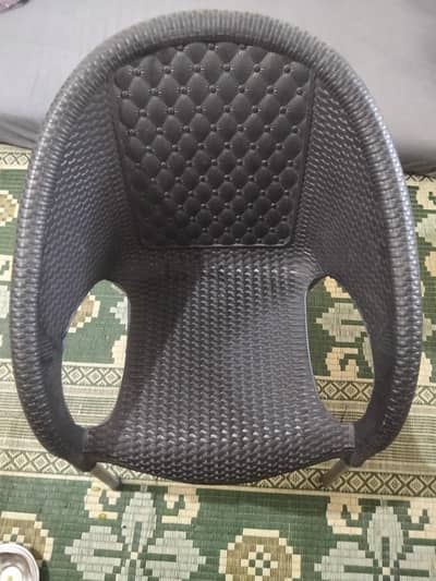black plastic chairs with table