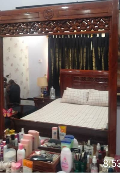 king size bed with side tables and dressing table