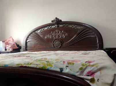 wooden bed and dressing table and side table