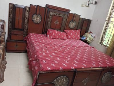 wooden bed with side tables