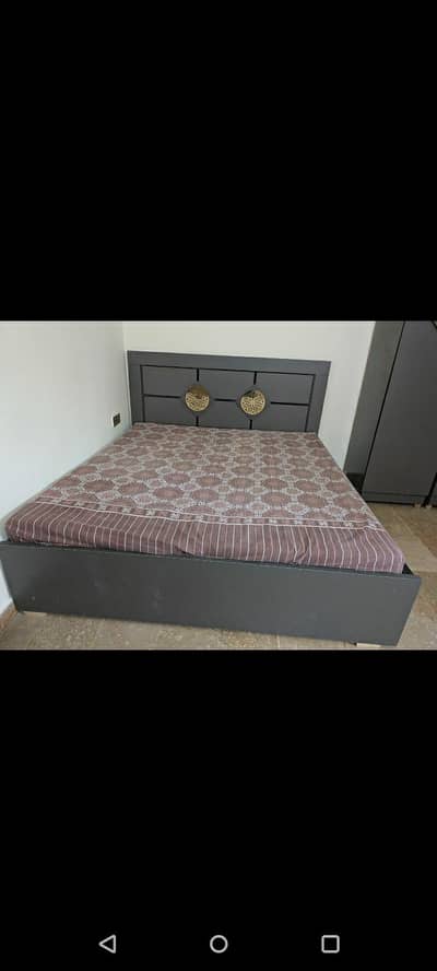 Urgently selling a bed with mattress and cabet