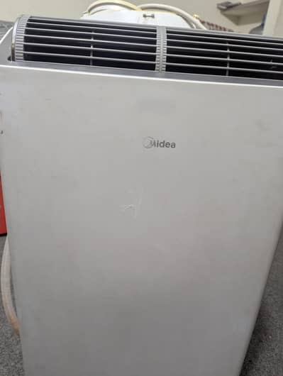 Midea 1.2 ton ac . 220volt