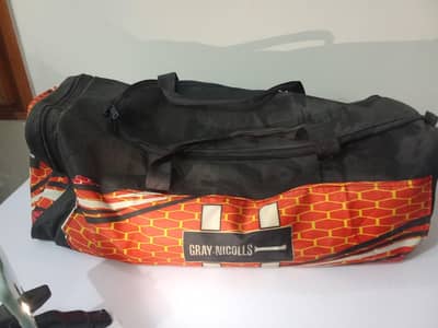 full cricket kit with bat and kit bag also