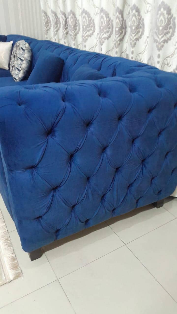 Blue L-shaped sofas 1