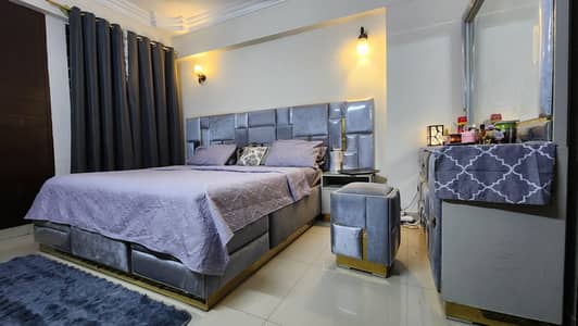 bed, side tables, dressing table with chair, cupboard
