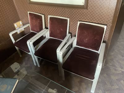 7 Wooden chairs for sale.