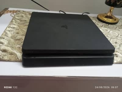 Playstation 4 slim used. with 2 controllers and 13 games.