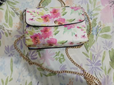 Pink and white hand bag