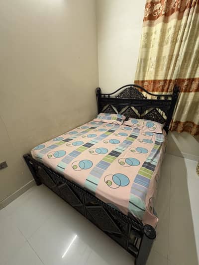 Rod iron queen bed with mattress