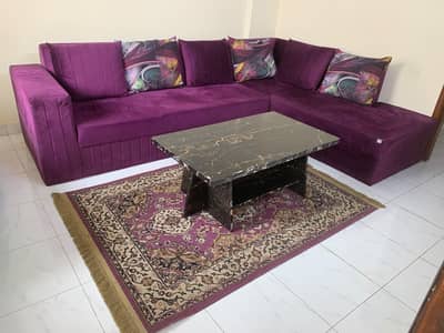 L-shaped sofa with center table and rug