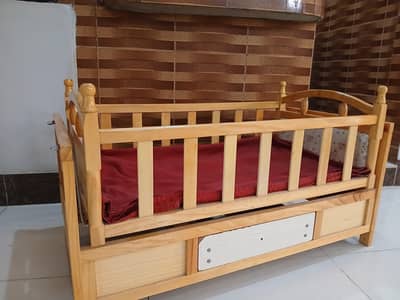 wooden baby cot along with swing
