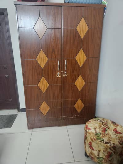wooden bed with cupboard