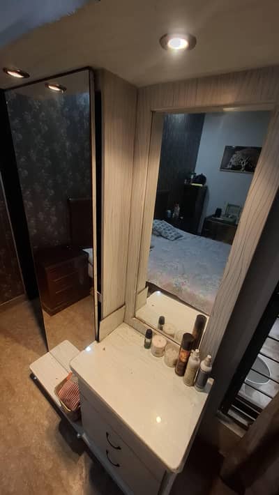Makeup vanity plus dual mirrors with yellow dim lights