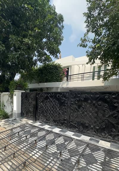One Kanal Used Modern Design Double Unit Bungalow For Sale At Prime Location Of DHA Lahore Near To Park Masjid & Commercial Market.