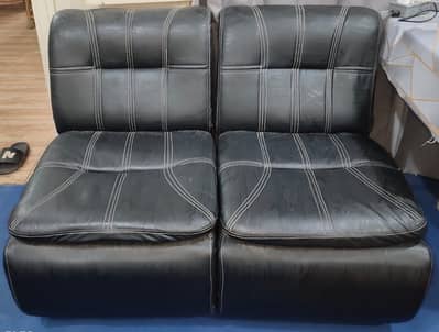 Two 1 seater sofas.