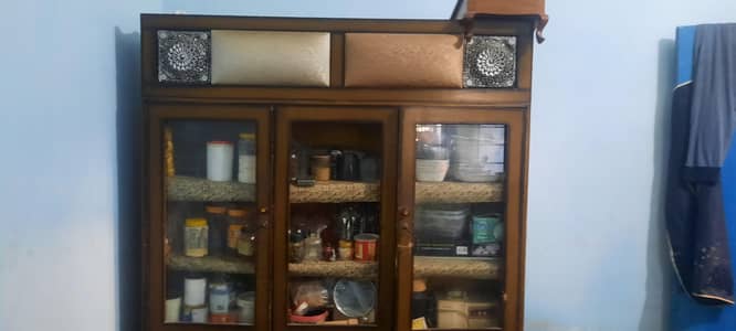 iam selling my wooden show case light brown with cousin work