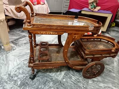 Elegant wooden & glass tea/serving trolley in good condition.