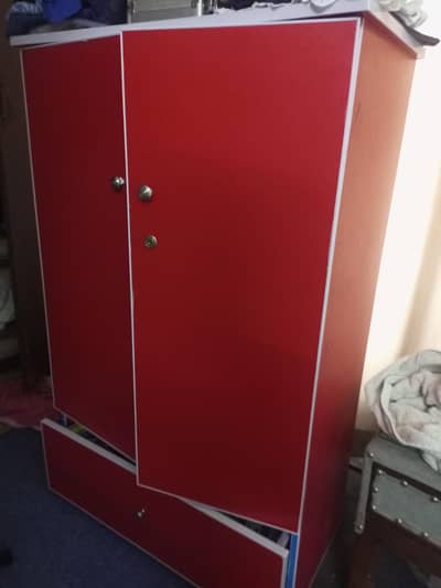 wardrobe with 3 shelves hanging area and a spacious drawer
