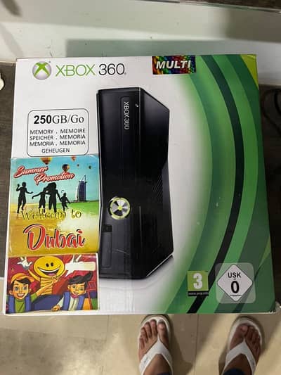 Xbox 360 slim J Tagged with 2 controllers for sale.