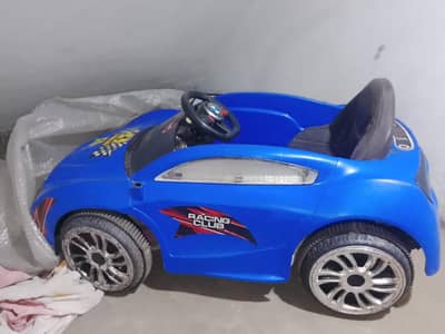 Blue kids bettery operated electric  car . . used