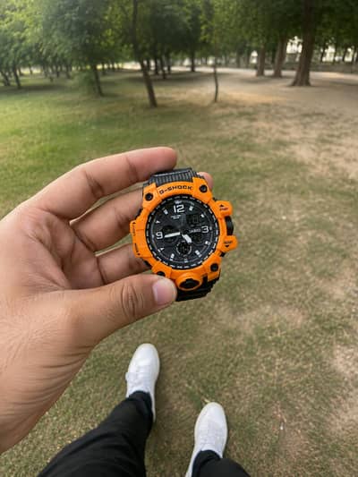 Casio Gshock in Orange and Black strap.
