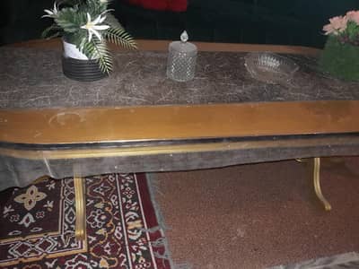 pure wooden table with golden polish in good condition