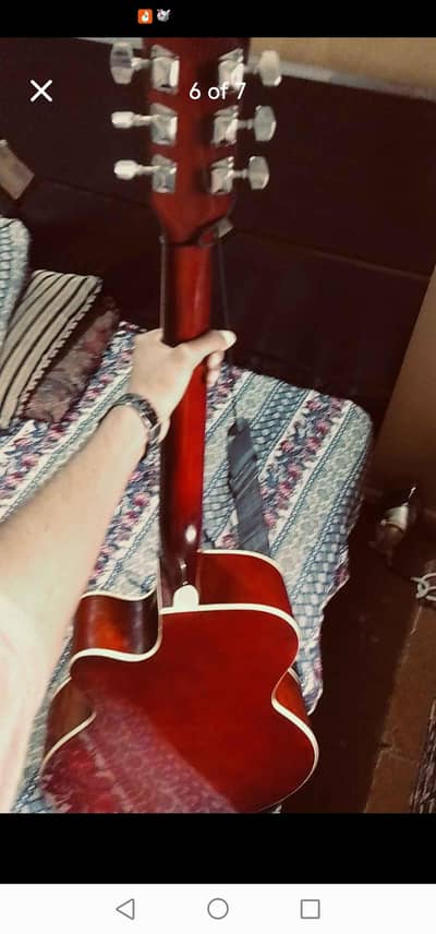 guitar with truss rod beg capo and pick