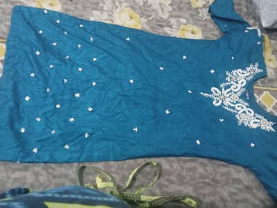 Beautiful teal color stitched dress with white pearl embroidery
