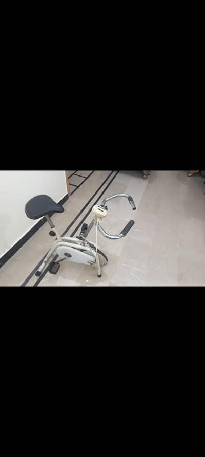 Gym stationary bike with adjustable resistance and meter.