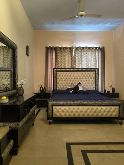 King size bed with side tables and dressing tas