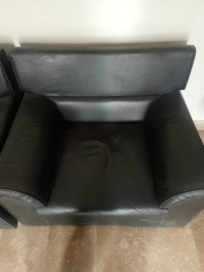Two 1 seater sofas 1