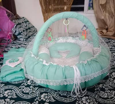 luxurious soft baby nest with net and toys available