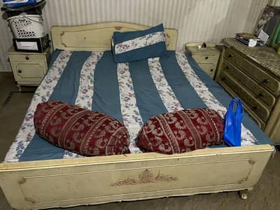 double bed with side tables and dressing