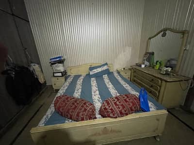 double bed with dressing and side tables