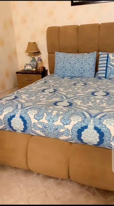 double bed with side table and sofa