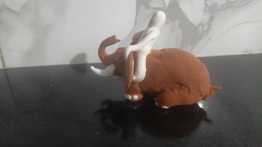 make a elephant with clay