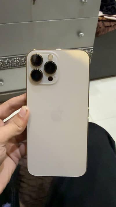 Apple iPhone 13 Pro Max with charger and cable