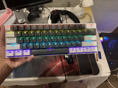A mechincal 60% keyboard,blue switched,name. . jedel kl 69