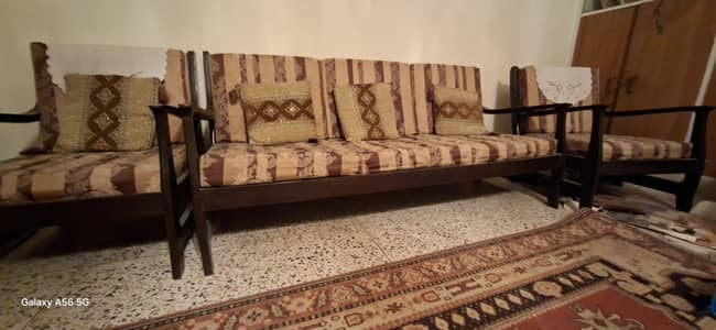 Solid 5 seater Wooden Sofa with cushions.