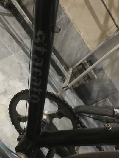 Racing cycle with four brakes